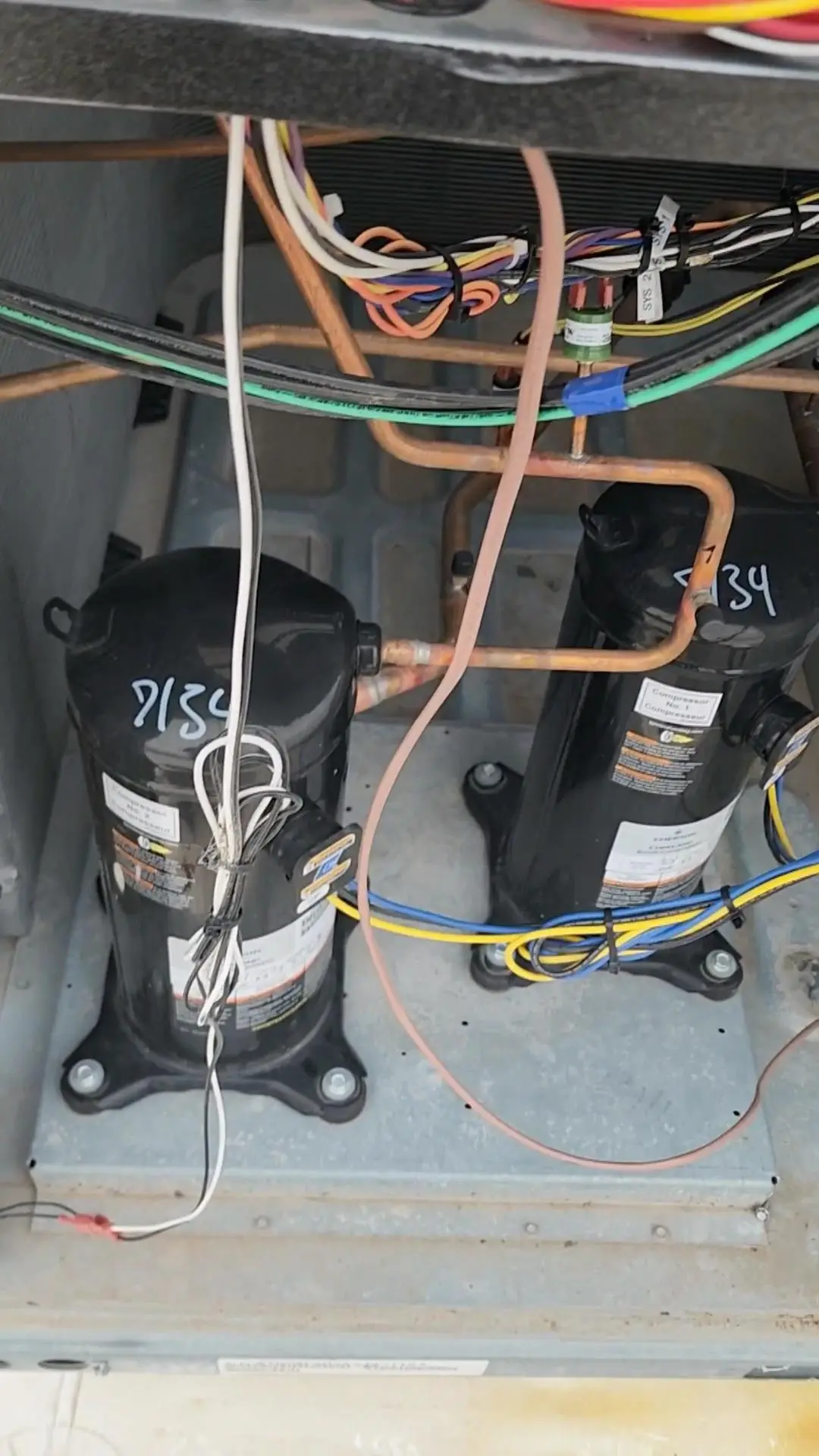 http://Two%20rooftop%20unit%20HVAC%20compressors%20found%20in%20commercial%20units
