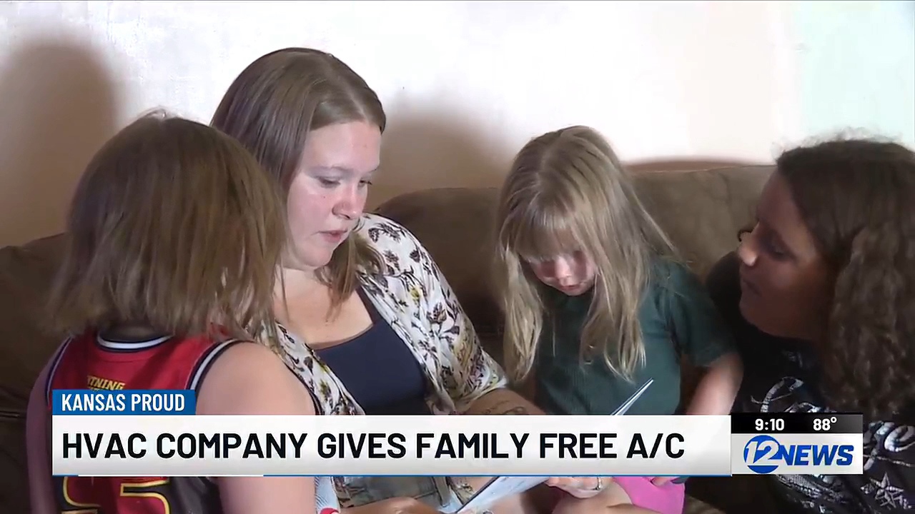 Hannah Brown on the couch with her three daughters, from the KWCH12 story